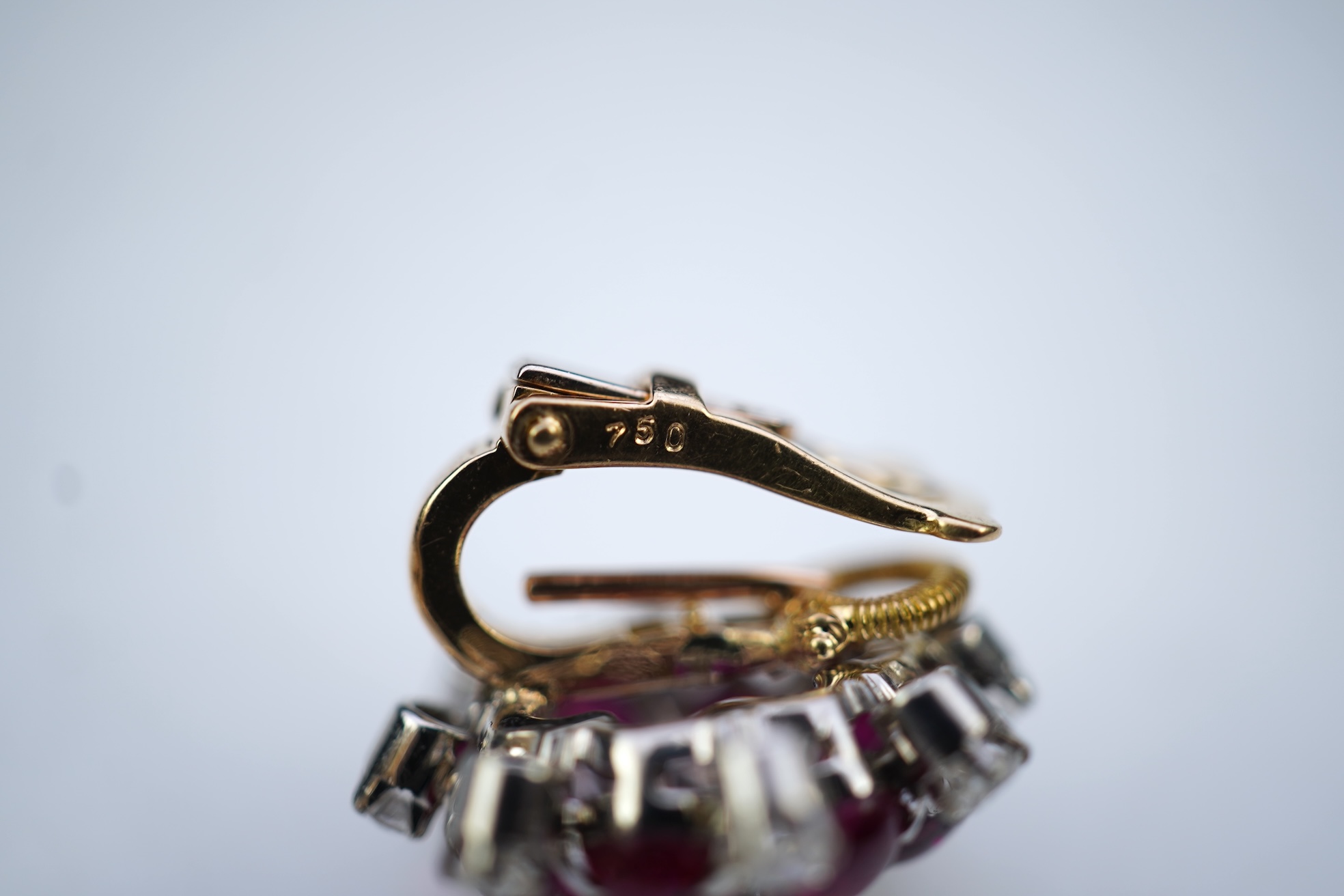 A pair of ruby and diamond ear clips, mid 20th century